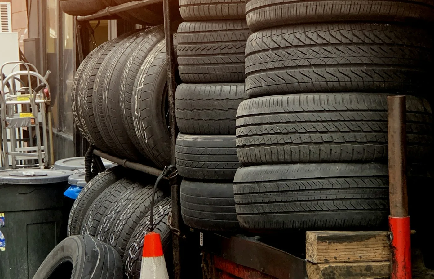 Commercial vehicle tyres stacked in a workshop